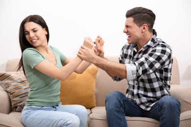 Photo of Couple having fight at home. Relationship problems