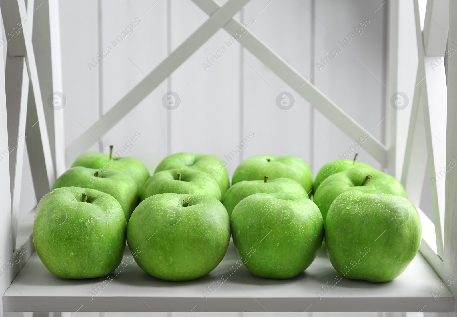 Photo of Fresh green apples on shelf