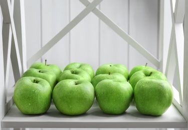 Fresh green apples on shelf