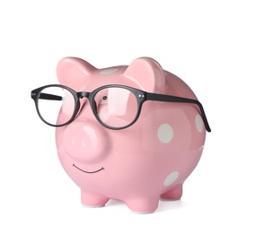 Photo of Piggy bank with glasses isolated on white
