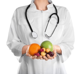 Photo of Female doctor with fresh products on white background. Cardiac diet