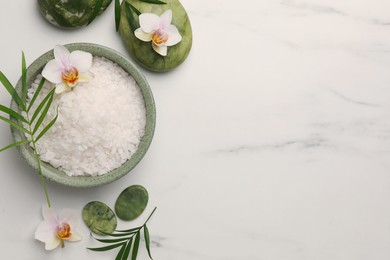 Photo of Flat lay composition with spa products and flowers on white marble table. Space for text