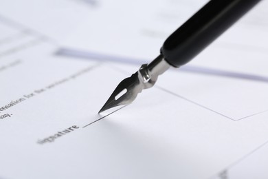 Photo of Signing notary document with fountain pen, closeup. Space for text