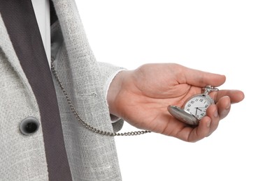 Photo of Businessman holding pocket watch on white background, closeup. Time management