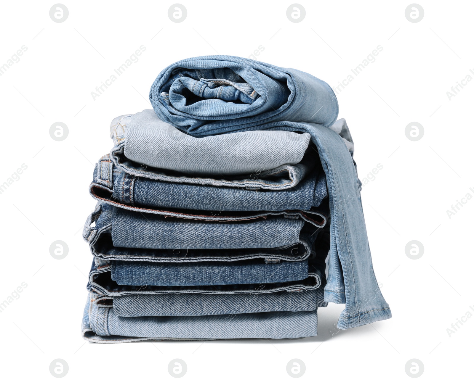 Image of Stack of different folded jeans isolated on white