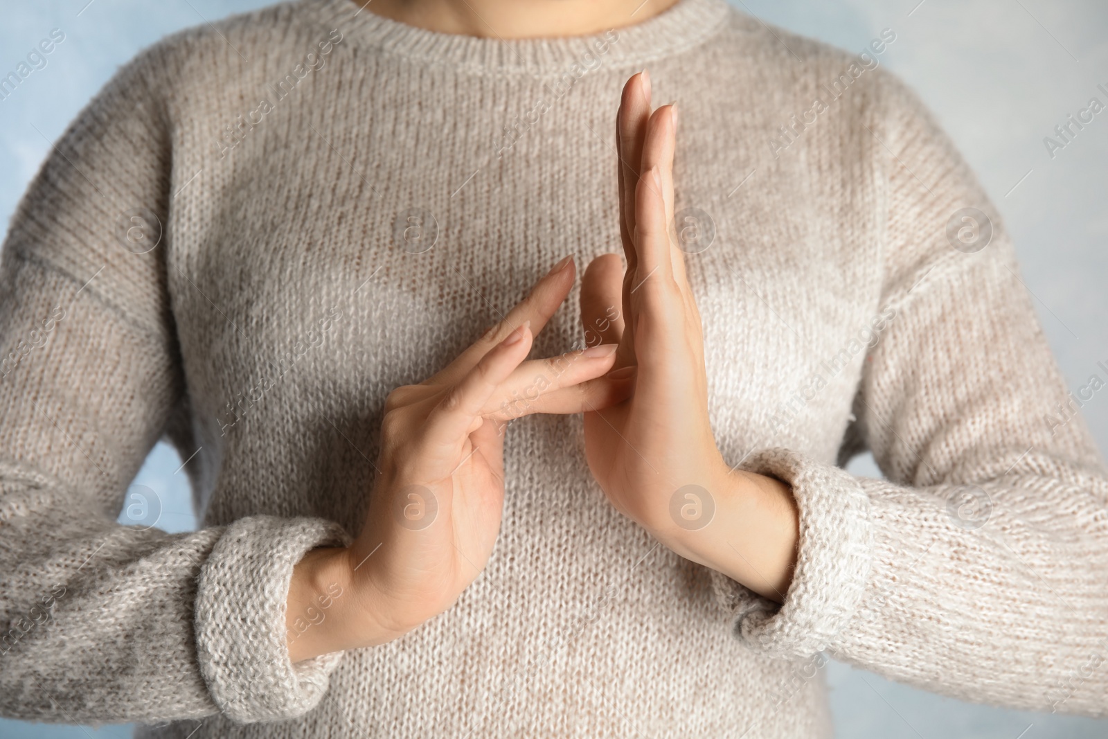 Photo of Woman showing word Jesus, closeup. Sign language