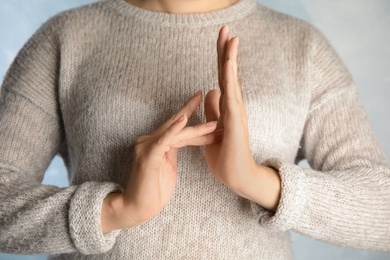 Photo of Woman showing word Jesus, closeup. Sign language