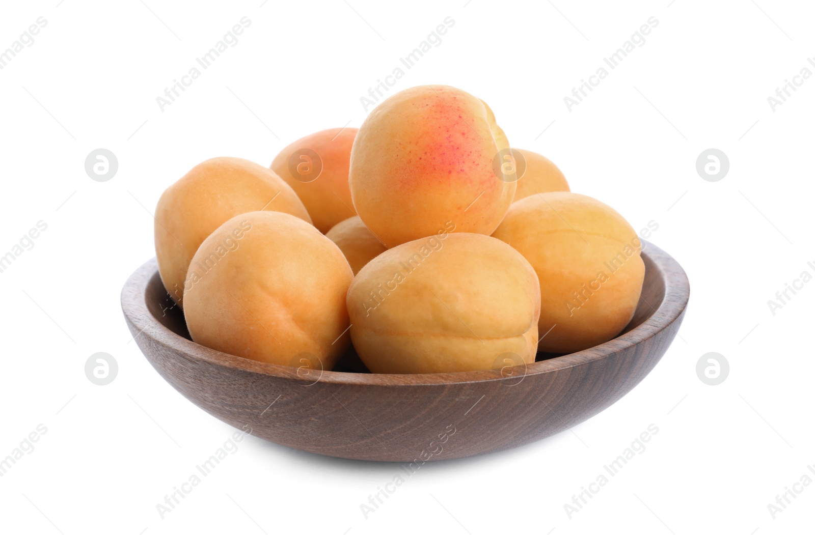 Photo of Delicious ripe apricots in wooden bowl isolated on white