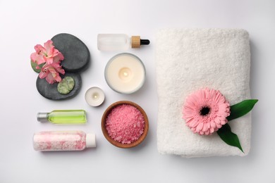 Photo of Flat lay composition with different spa products and beautiful flower on white table