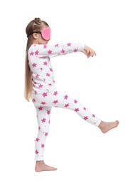 Photo of Girl in pajamas and sleep mask sleepwalking on white background