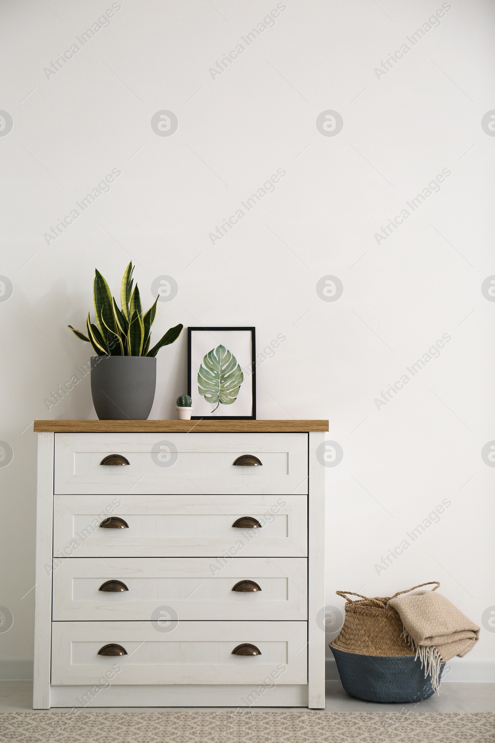 Photo of Stylish chest of drawers in living room interior