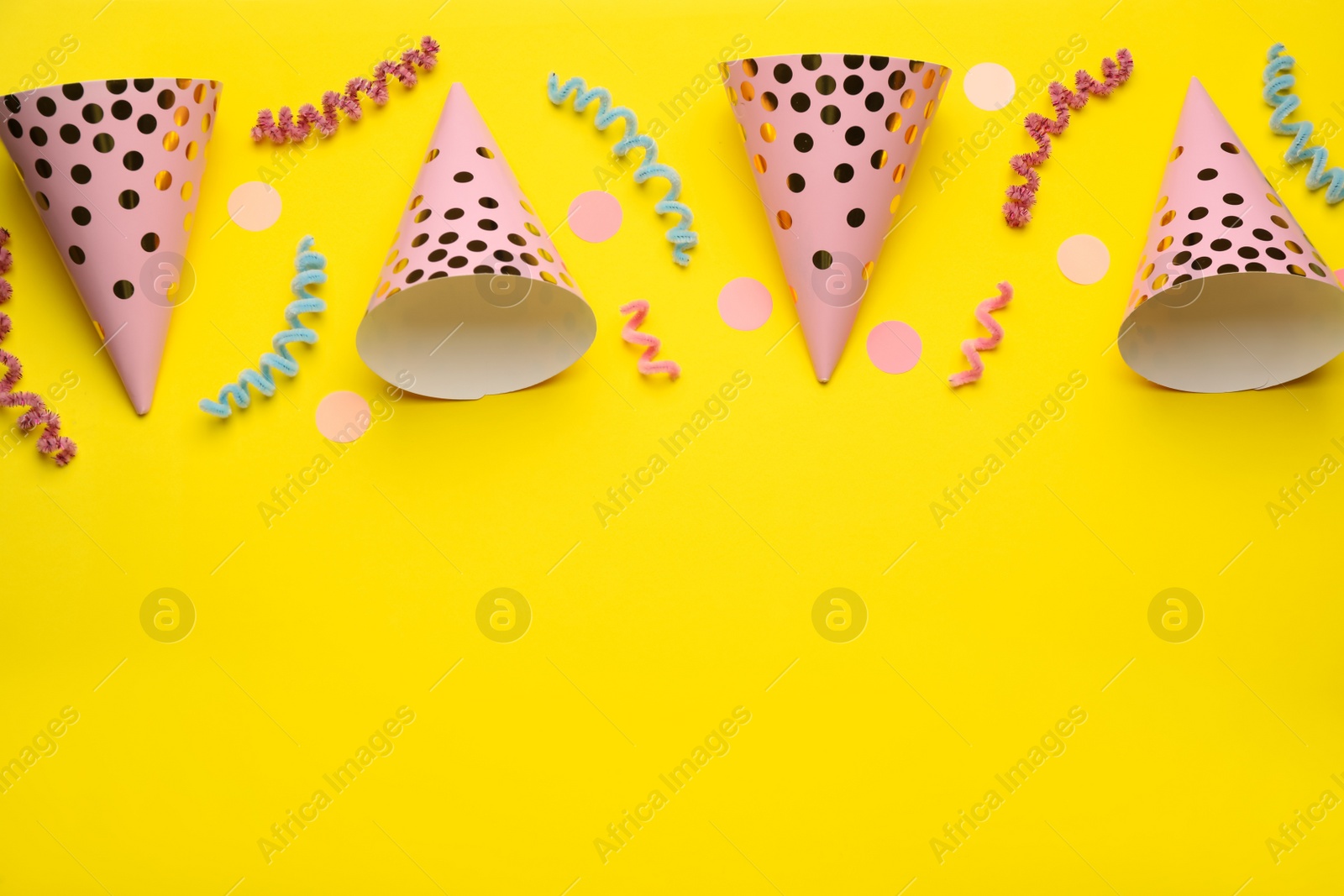 Photo of Flat lay composition with party items on yellow background, space for text