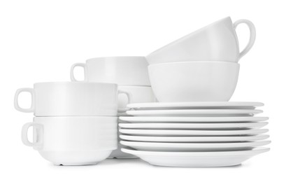 Photo of Set of clean dishware isolated on white