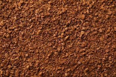 Photo of Aromatic instant coffee as background, top view