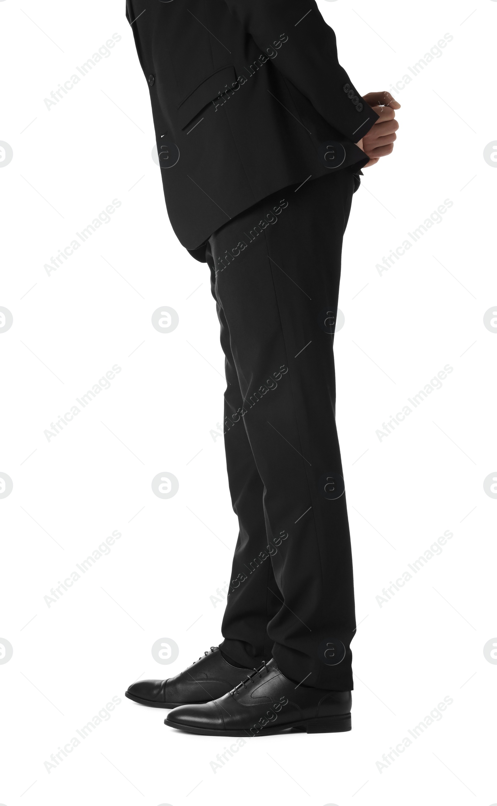 Photo of Businessman in leather shoes on white background, closeup