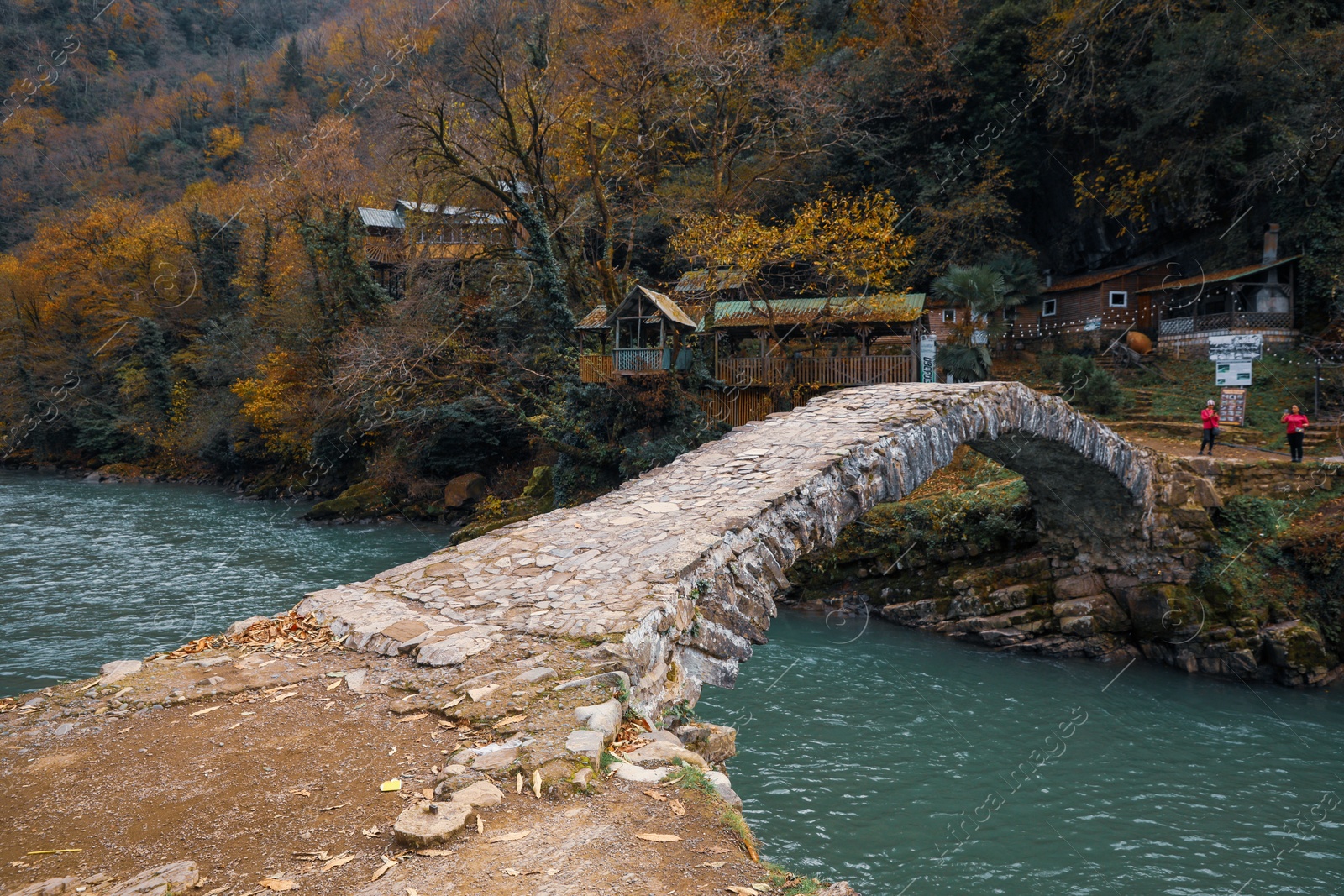 Photo of Adjara, Georgia - November 19, 2022: Picturesque view of stone arched bridge over Acharistskali river