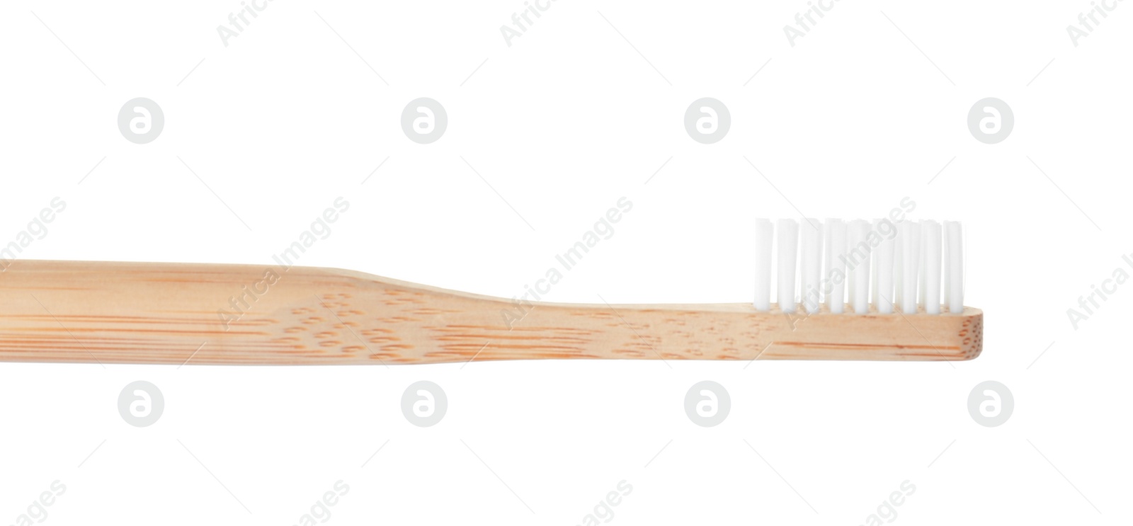 Photo of Bamboo toothbrush on white background. Dental care