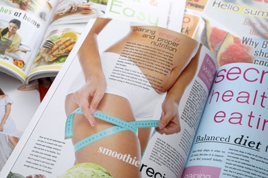 Variety of women's modern magazines, closeup view