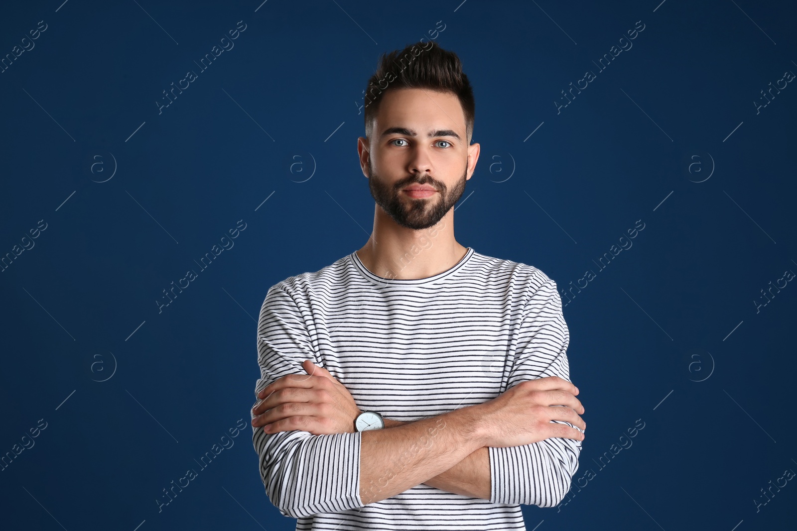 Photo of Portrait of handsome young man on color background