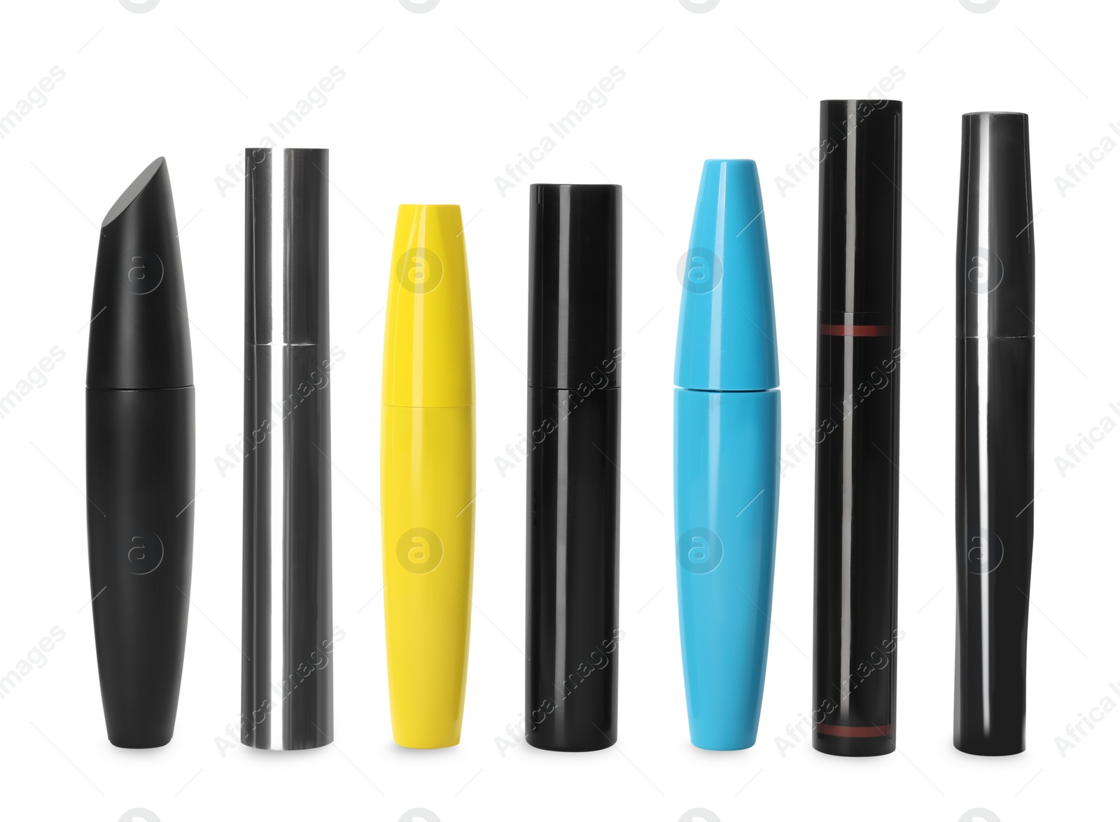 Photo of Many mascaras for eyelashes on white background. Makeup product