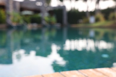 Blurred view of outdoor swimming pool at luxury resort