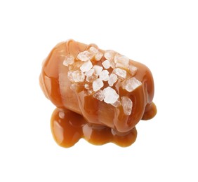 Photo of Yummy candy with caramel sauce and sea salt isolated on white