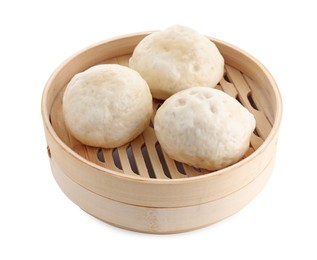 Photo of Delicious chinese steamed buns in bamboo steamer isolated on white