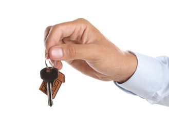 Photo of Real estate agent with key on white background