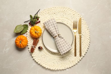 Stylish autumn table setting on light background, flat lay