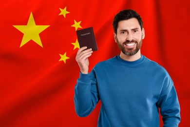 Immigration. Happy man with passport against national flag of China, space for text