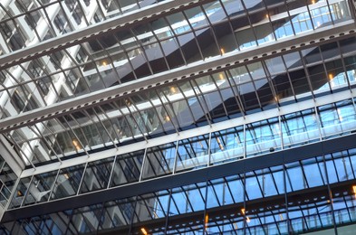 Photo of Beautiful building facade with windows, low angle view