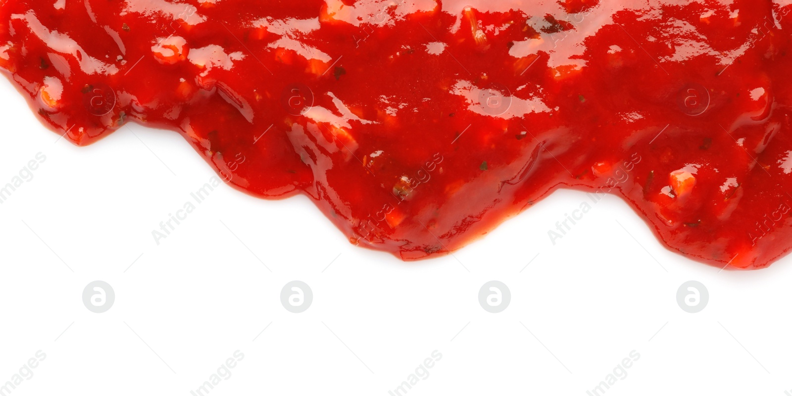 Photo of Tasty spicy chili sauce on white background