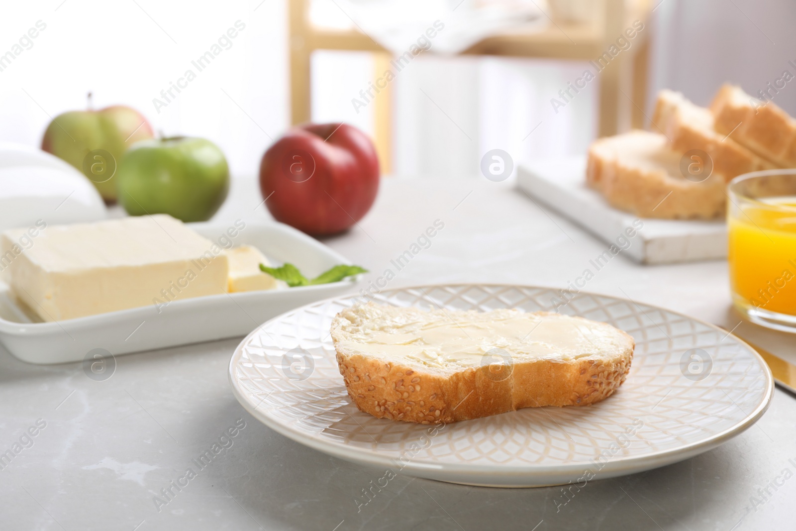 Photo of Fresh bread with tasty butter on plate