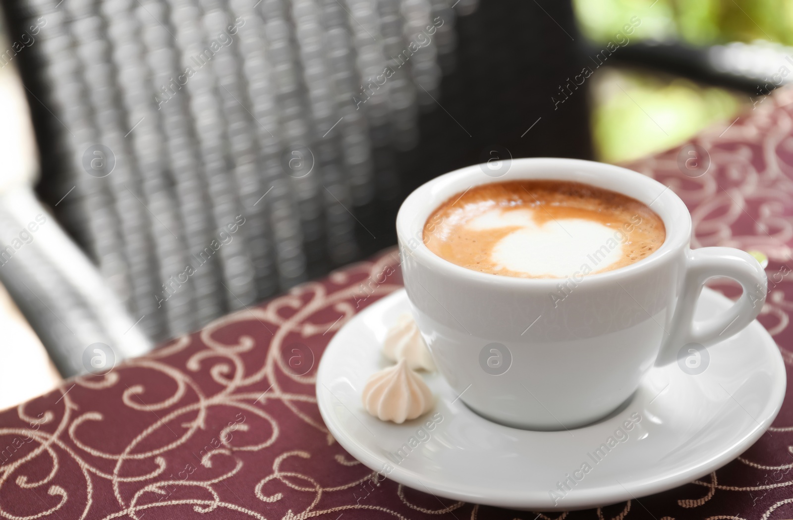 Photo of Cup of delicious aromatic coffee on table