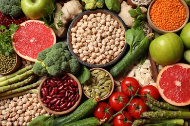 Fresh vegetables, fruits and seeds on table, flat lay