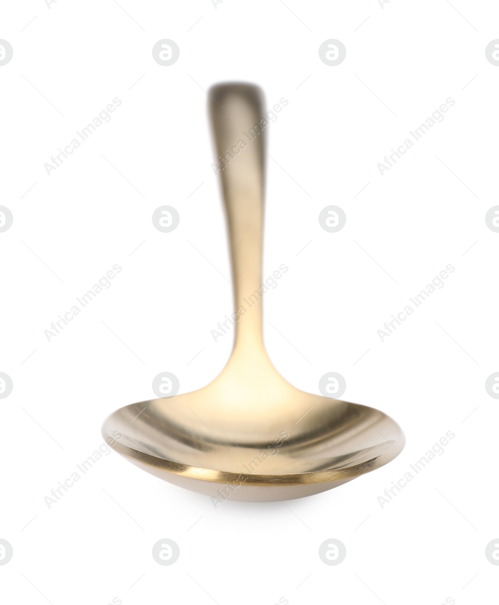 Photo of One shiny golden spoon isolated on white