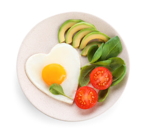 Photo of Plate of tasty breakfast with heart shaped fried egg isolated on white, top view