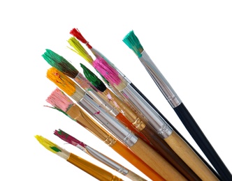 Photo of Different brushes with paints on white background