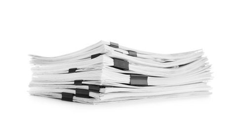 Stack of documents with black clips on white background