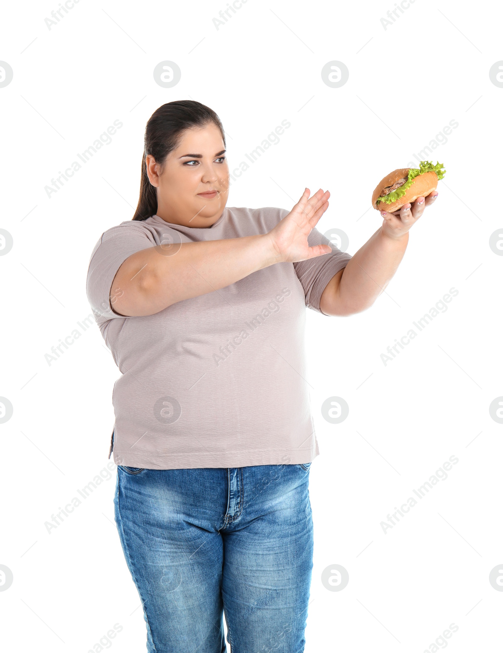 Photo of Overweight woman with hamburger on white background