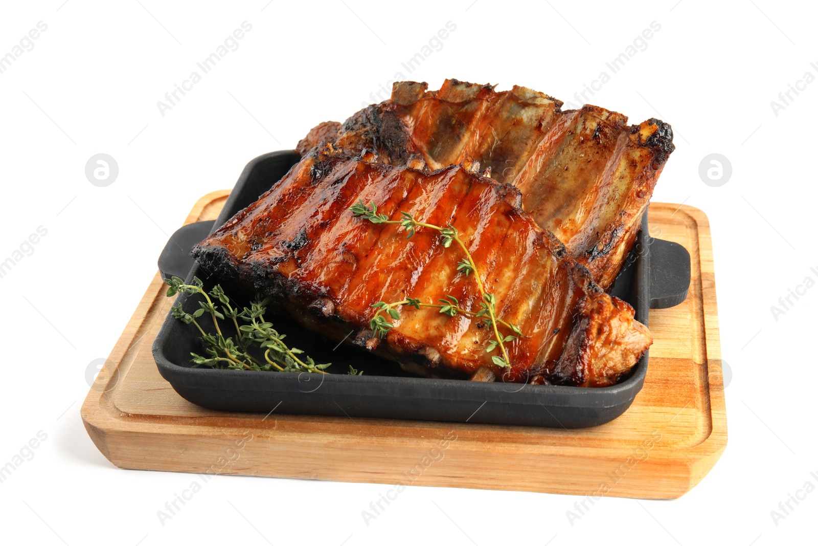 Photo of Tasty grilled ribs with thyme isolated on white