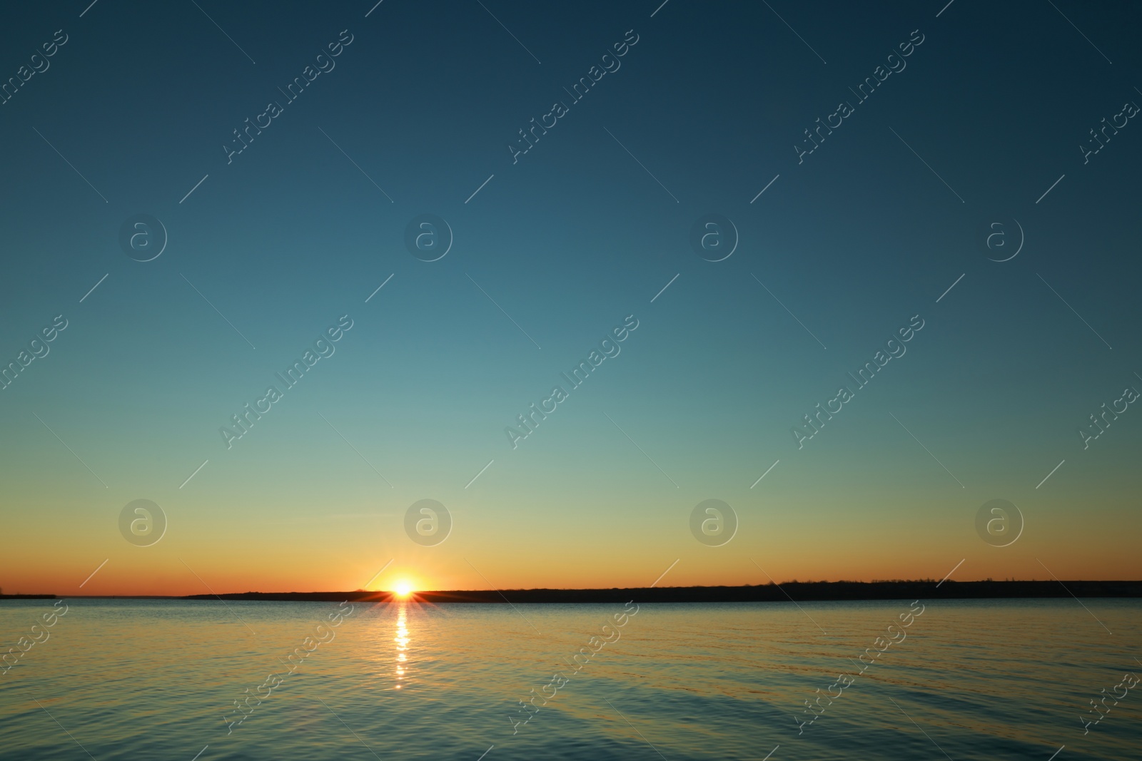 Photo of Picturesque view of beautiful sunset over calm river