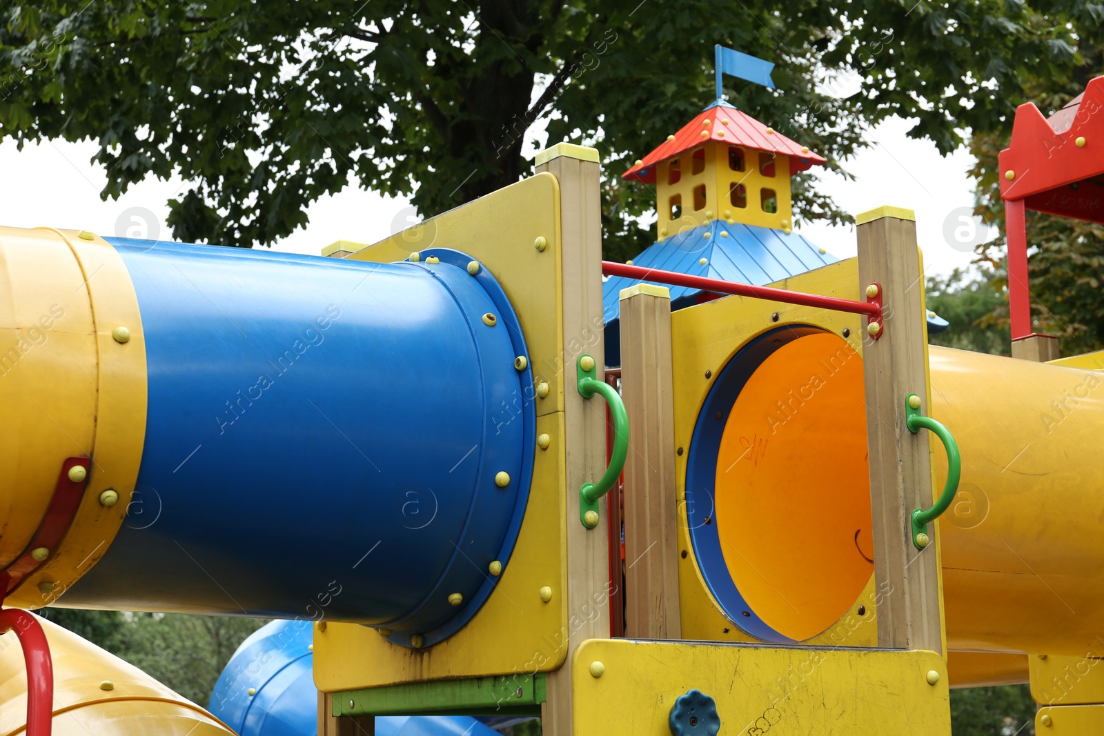 Photo of Children's playground with bright slides on summer day