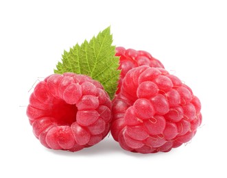 Photo of Fresh ripe raspberries and green leaf isolated on white