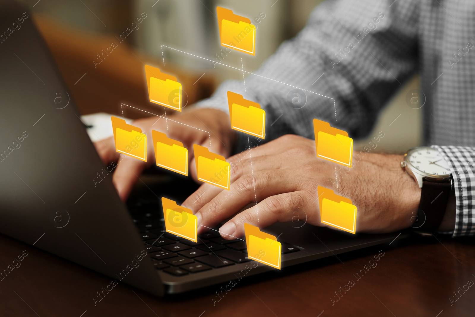 Image of File system. Man using laptop at table, closeup. Scheme with folders over computer