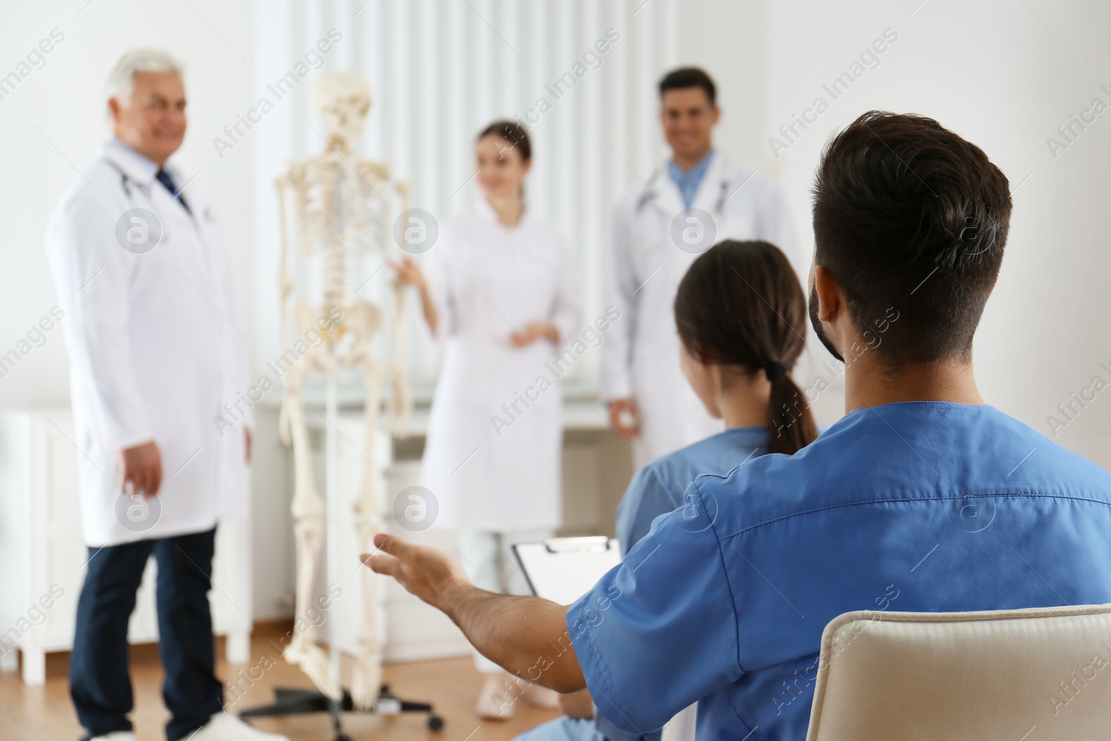 Photo of Medical students having lecture in orthopedics at clinic