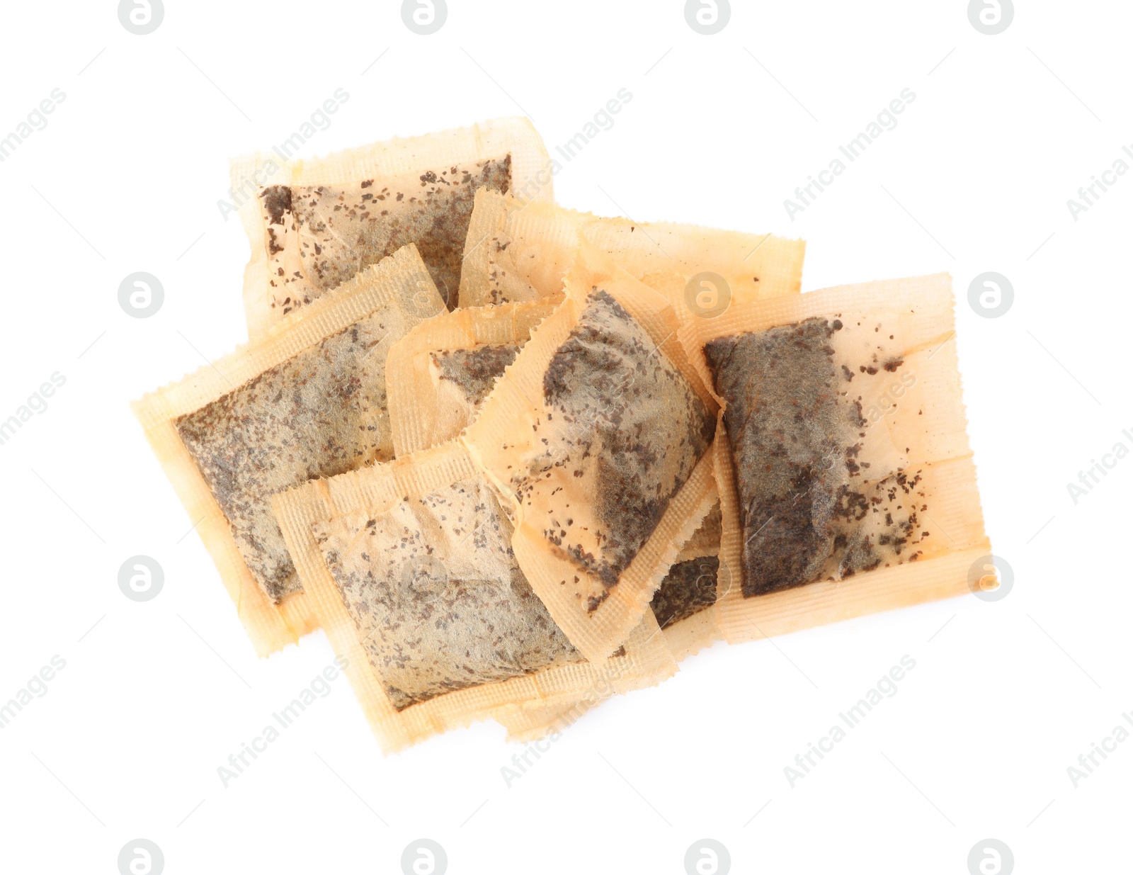 Photo of Used tea bags on white background, top view