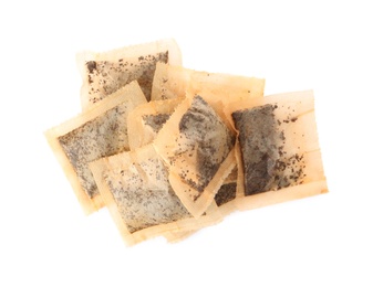 Photo of Used tea bags on white background, top view