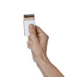 Photo of Man holding box with matches on white background, closeup