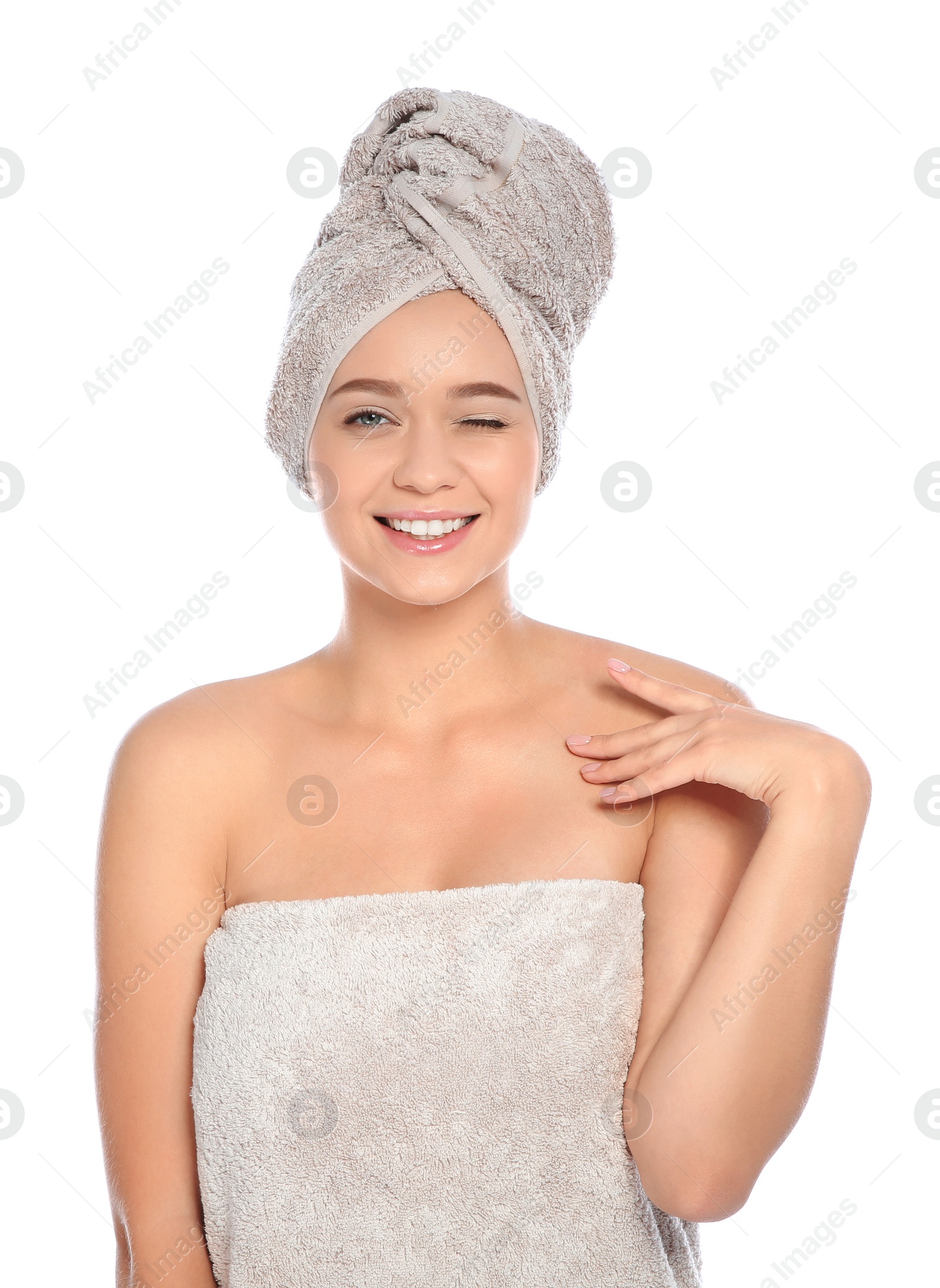 Photo of Portrait of young pretty woman with towels on white background